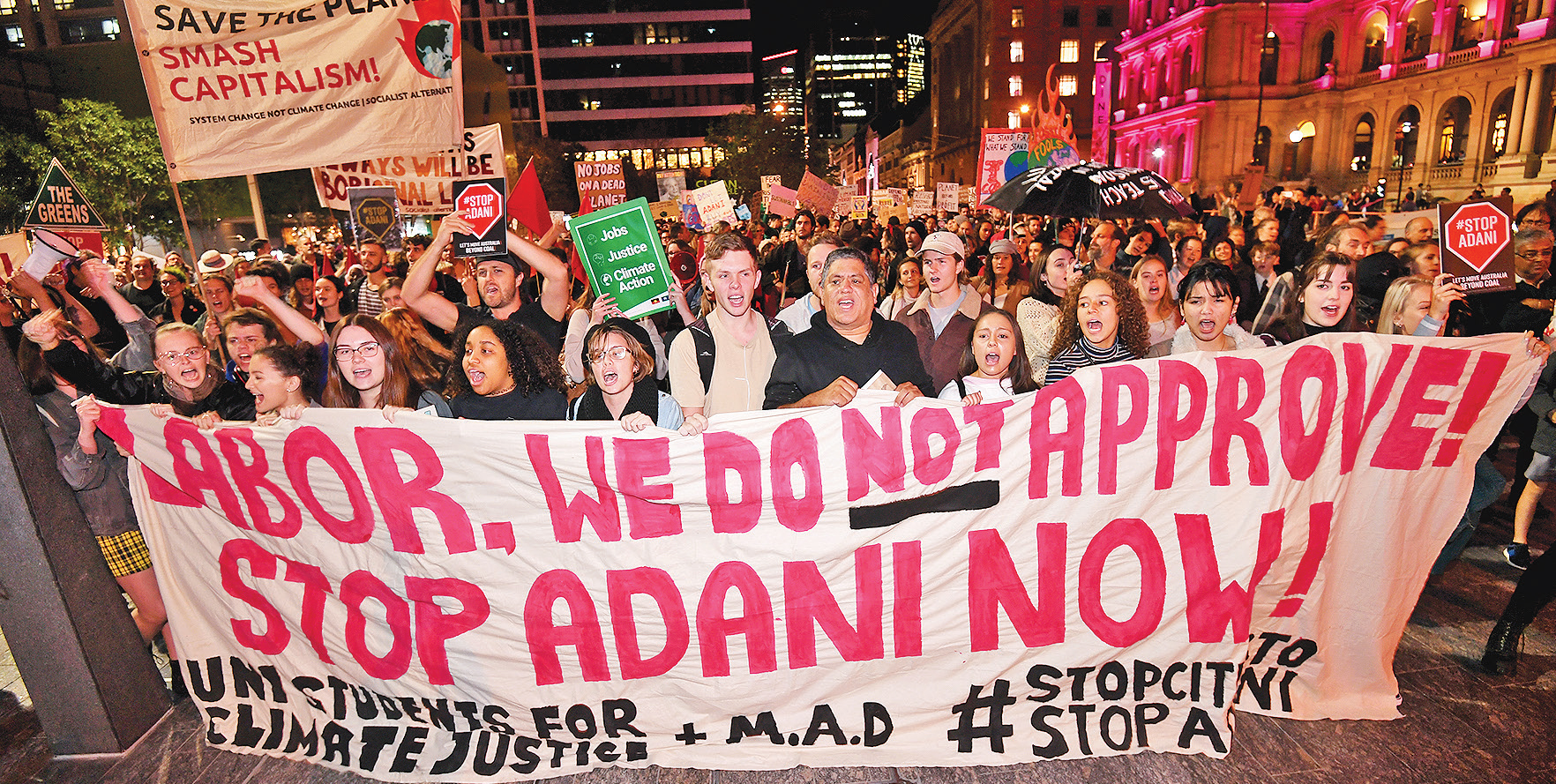 Several people have been arrested and released without charge after gluing themselves to a Brisbane road during a protest against the Queensland Government’s approval of the Adani coal mine.